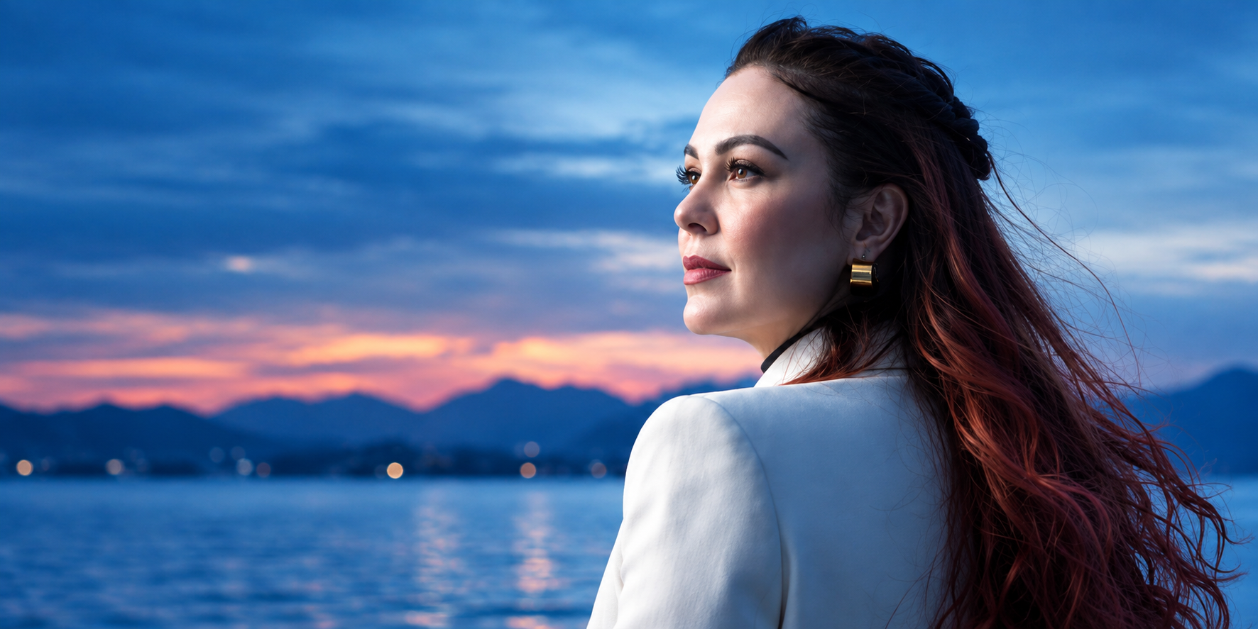 Confident woman with radiant healthy skin by the sea at sunset